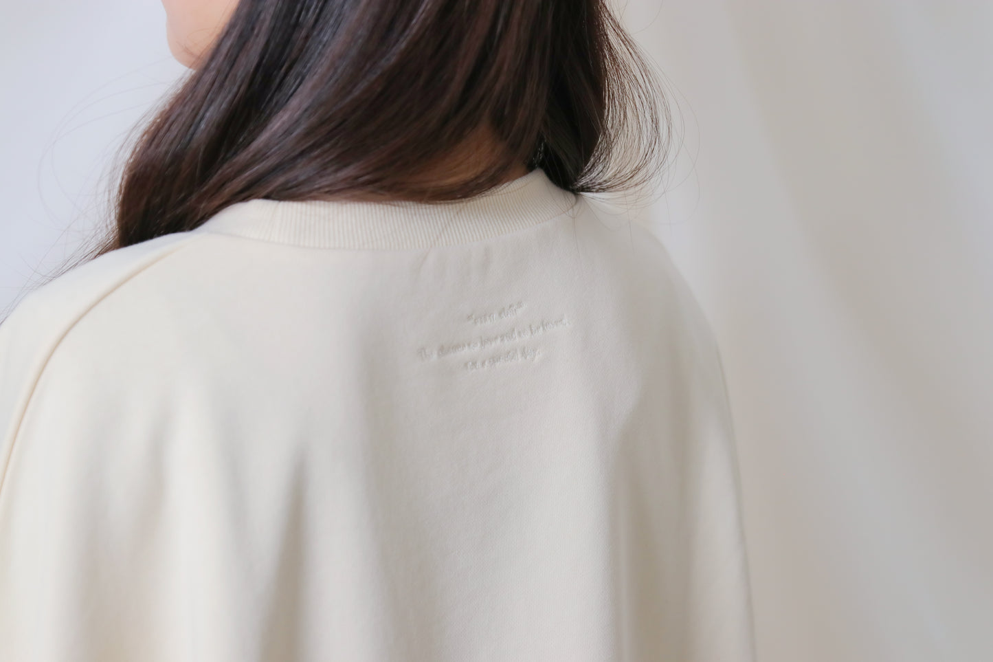 umm. logo over sweat