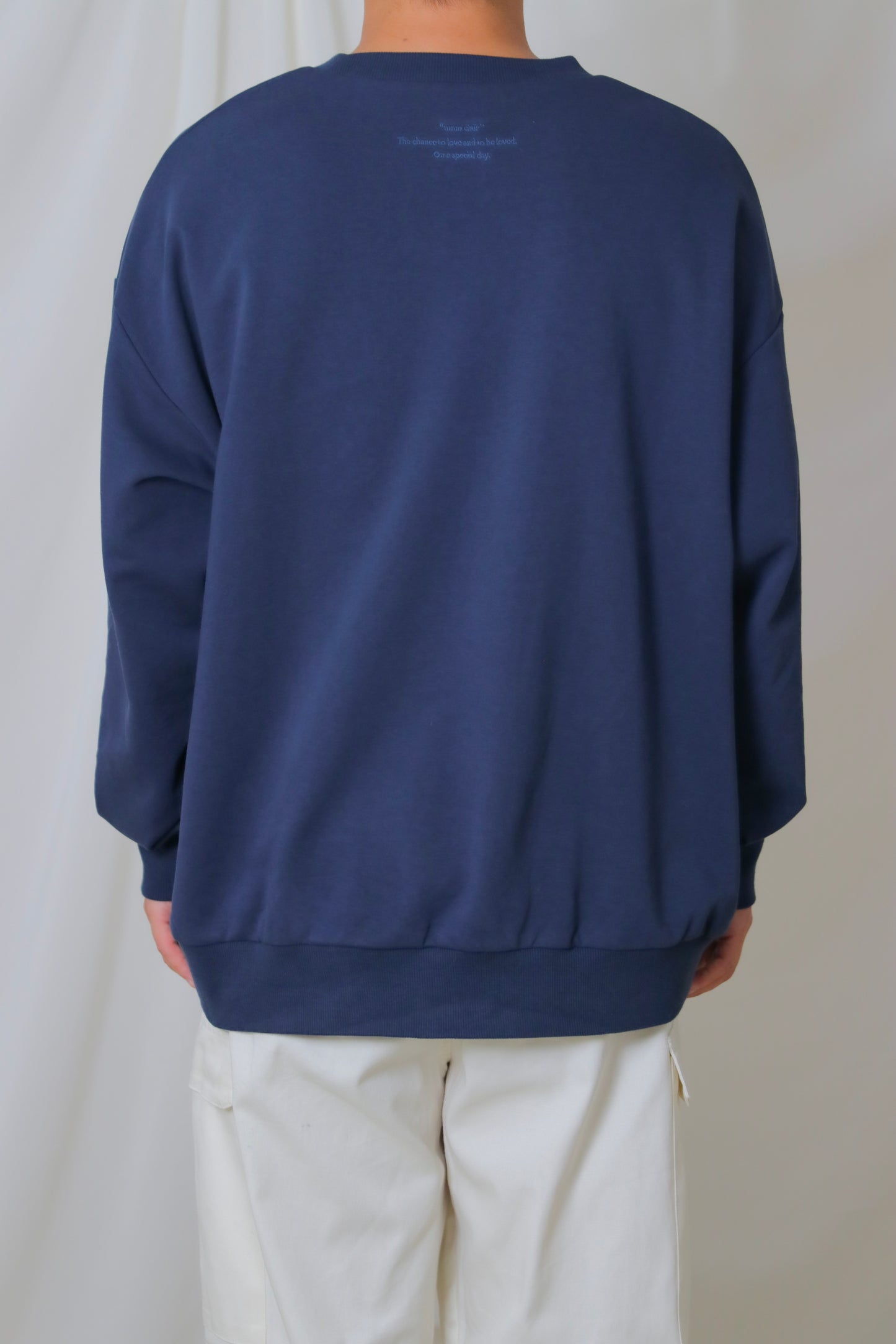 umm. logo over sweat