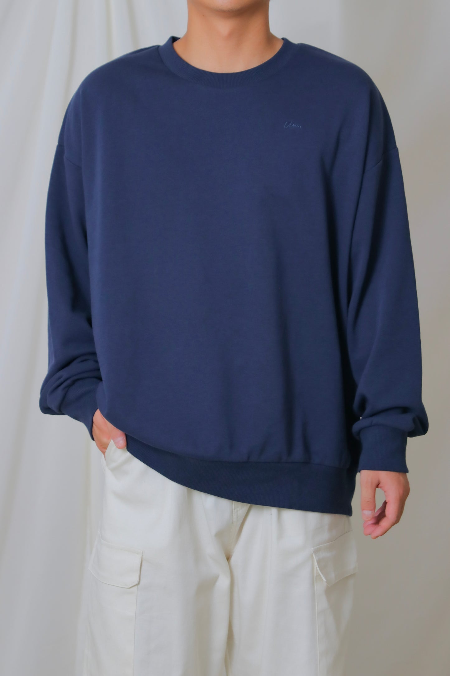 umm. logo over sweat