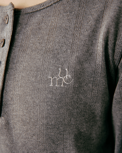 Henley neck Umm logo tops